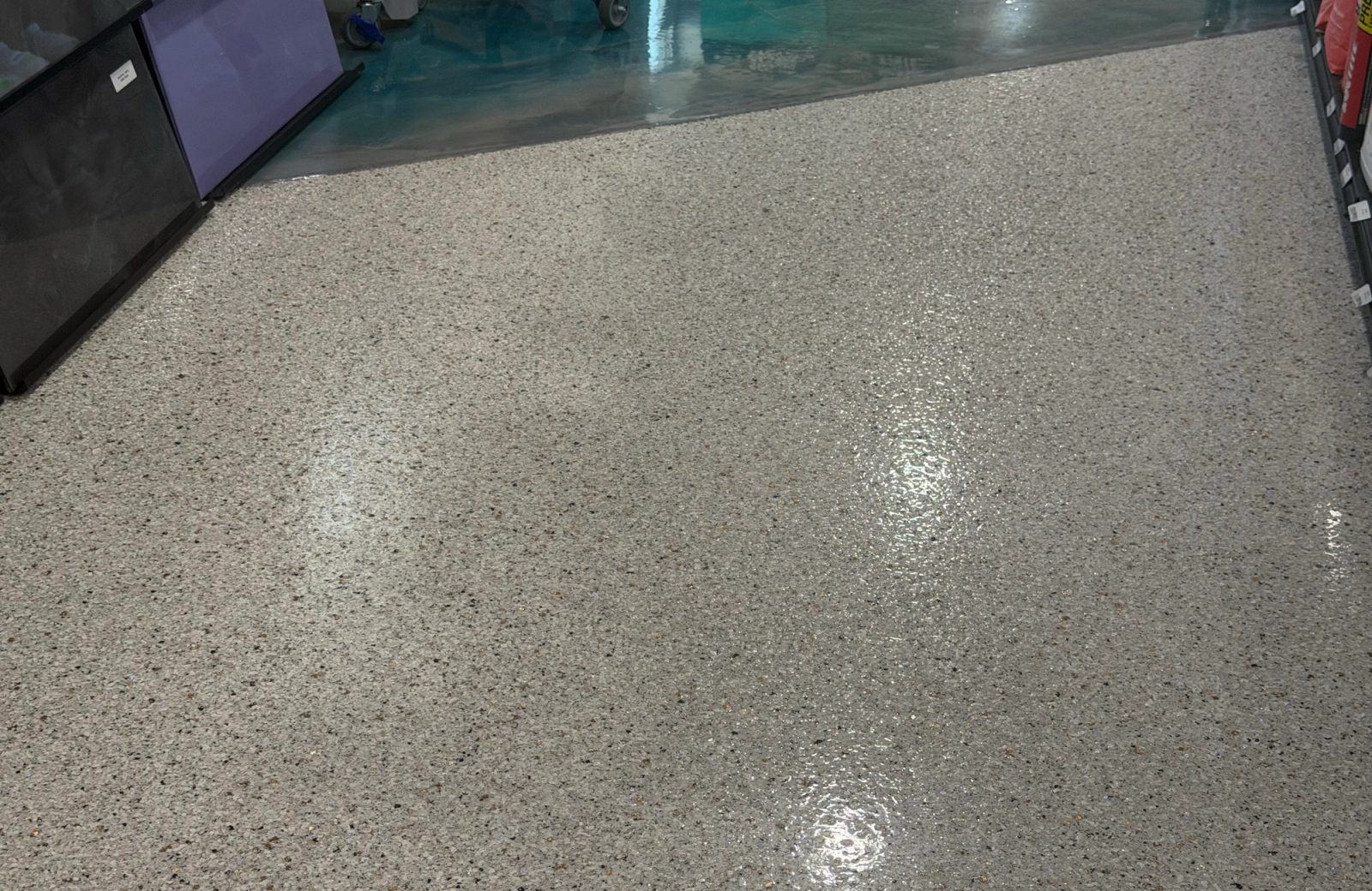 Glossy flake floor coating in a finished interior, Des Moines Iowa